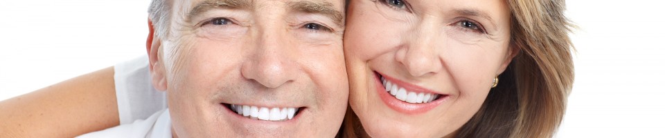 Happy seniors couple in love. Healthy teeth. Isolated over white background